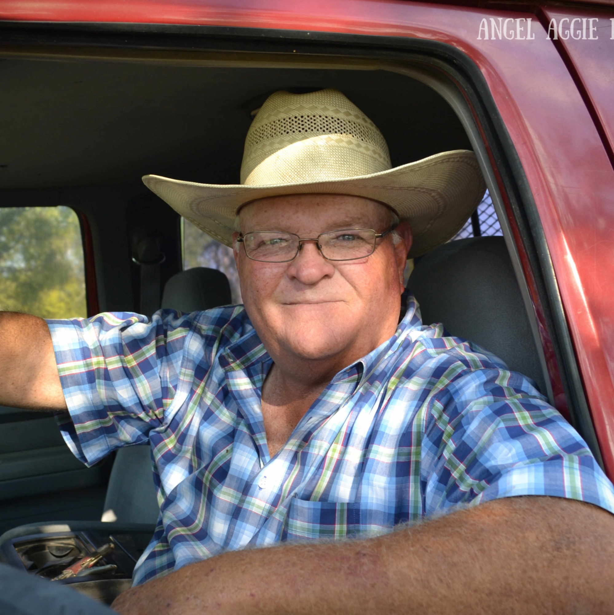 On the ranch, behind the wheel
